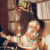 Gayance DJing among shelves of vinyl records